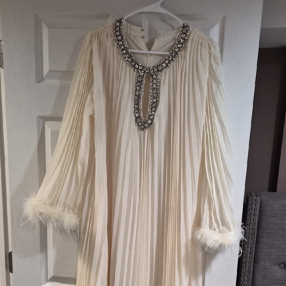 Elegant Cream Dress with Embellished Neckline